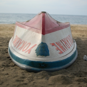 Boat "Yokarimbe" upside-down on a beach on the Caribbean coast of Costa Rica