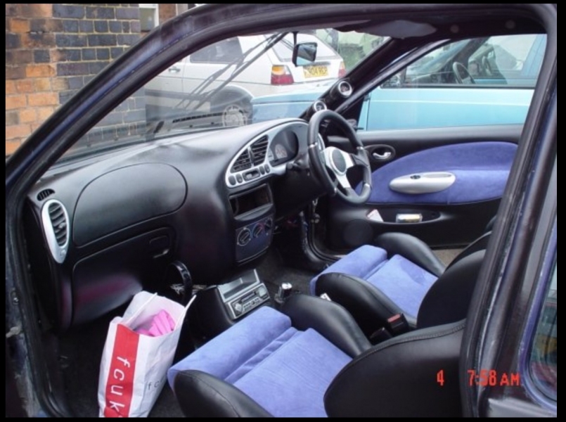 Shed 1's interior, with alcantara and pleather Recaro seats, shiny silver bits, and dodgy heating